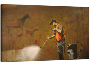 Banksy Canvas Pictures - Man Cleaning and Removing a Prehistoric Cave Painting - Urban Art